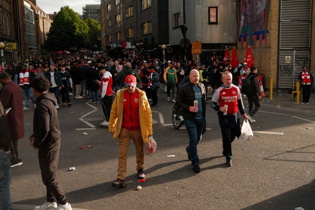 Arsenal v Burnley 18 May 2026, London - Premier League Football - Arsenal v Burnley - Arsenal fans walk through a patch of sunlight on their way to the Stadium - Photo: Jacques Feeney Offside. London UK Copyright: xJacquesxFeeneyx xOffsidexOffside