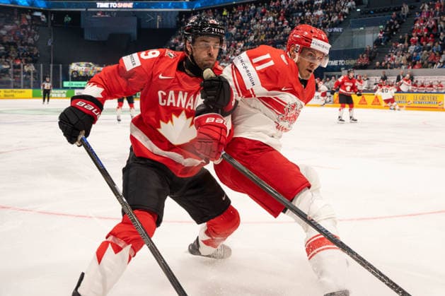 FRIBOURG, FRIBOURG - MAY 18: Parker Wotherspoon of Canada battles with Alexander True of Denmark during the 2026 IIHF World Championship, WM, Weltmeisterschaft Preliminary Round Group B match between Canada and Denmark at BCF Arena on May 18, 2026 in Fribourg, Fribourg, Switzerland.  Copyright: xLivioxBaeriswylx xSPPx Sportspressphoto_SPR149934