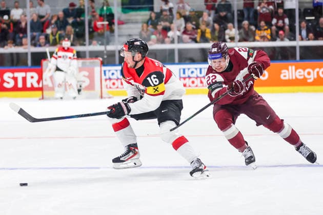 Ice hockey, Eishockey - IIHF WC 2026 ZURICH,SWITZERLAND,19.MAY.26 - ICE HOCKEY - IIHF Ice Hockey World Championship, WM, Weltmeisterschaft 2026, group stage, Austria vs Latvia. Image shows Dominic Zwerger (AUT) and Toms Andersons (LAT).  GEPAxpictures xMaticxKlansek