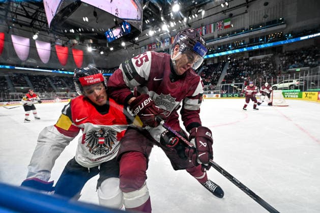 ZURICH, SWITZERLAND - MAY 19: Simeon Schwinger of Austria and Roberts Mamcics of Latvia in a battle along the boards during the 2026 IIHF Ice hockey, Eishockey World Championship, WM, Weltmeisterschaft Switzerland game between Latvia and Austria at Swiss Life Arena on May 19, 2026 in Zurich, Zurich. Zurich Swiss Life Arena Zurich Switzerland Copyright: xJustPictures.ch AndreaxBrancax jp-en-EuSpIm-JP7_ANB_Lat_Aut_19052026_6177