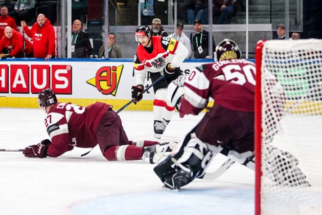 Ice hockey, Eishockey - IIHF WC 2026 ZURICH,SWITZERLAND,19.MAY.26 - ICE HOCKEY - IIHF Ice Hockey World Championship, WM, Weltmeisterschaft 2026, group stage, Austria vs Latvia. Image shows Oskars Cibulskis (LAT), Lucas Thaler (AUT) and Kristers Gudlevskis (LAT).  GEPAxpictures xMaticxKlansek