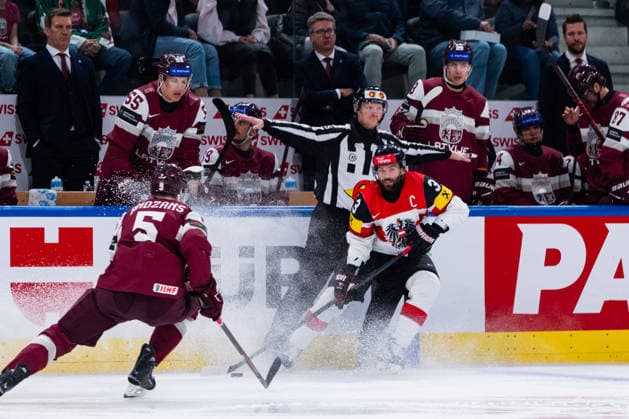ZURICH, SWITZERLAND - MAY 19: Peter Schneider (Austria, 3) ba- Artus Andzans (Latvia, 5) during the Preliminary Round - Group A Match 21 between Latvia and Austria at the IIHF Ice hockey, Eishockey World Championship, WM, Weltmeisterschaft 2026, Swiss Life Arena on May 19, 2026 in Zurich, Switzerland. Zurich Switzerland Copyright: xTimoxSteinx