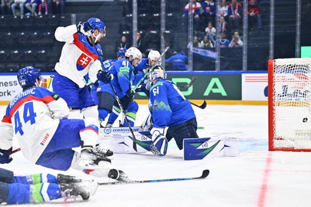 L-R Marek Hrivik (SVK) scores against goalkeeper Lukas Horak (SLO) during the 2026 IIHF World Championship, WM, Weltmeisterschaft Group B, match Slovenia vs Slovakia, Fribourg, Switzerland, on May 19, 2026. (CTKxPhoto RadekxPetrasek) CTKPhotoP2026051908730  CTKPhotoP2026051908730