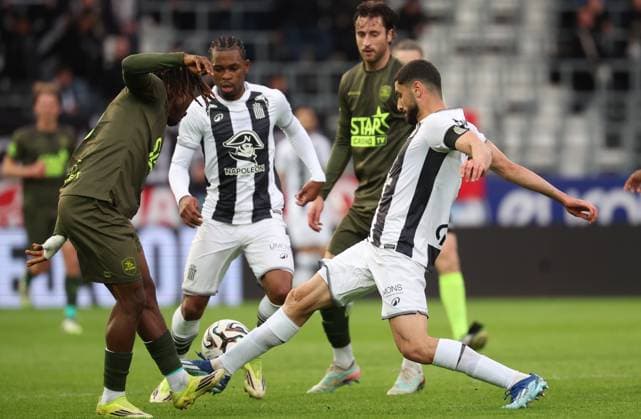 OHL s Abdoul Karim Traore and Charleroi s Aiham Ousou fight for the ball during a soccer match between Sporting Charleroi and Oud-Heverlee Leuven, Tuesday 19 May 2026 in Charleroi, on the ninth day of the Europe Play-offs (PO2) of the 2025-2026 Jupiler Pro League first division of the Belgian championship. VIRGINIExLEFOUR  x174438442x