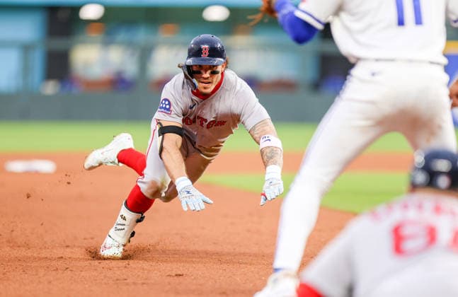 MAY 19, 2026: Boston Red Sox outfielder Jarren Duran (16) prepares to slide into third base against the Kansas City Royals at Kauffman Stadium in Kansas City, MO. CSM Kansas City United States - ZUMAc04_ 20260519_zma_c04_226 Copyright: xRomanxPunox
