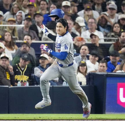 Baseball: Dodgers vs. Padres Los Angeles Dodgers designated hitter Shohei Ohtani throws off his helmet as he rounds the bases after hitting a double during the eighth inning of a baseball game against the San Diego Padres at Petco Park in San Diego, California, on May 19, 2026.  A14AA0005587197P