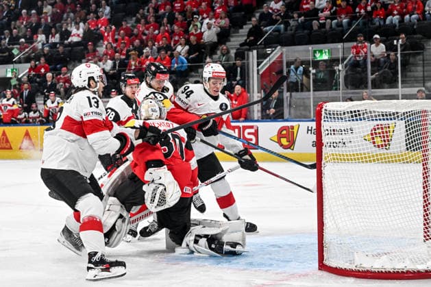 ZURICH, SWITZERLAND - MAY 20: Attilio Biasca of Switzerland R) and Nico Hischier of Switzerland L) battle for the puck against goalkeeper David Kickert of Austria during the 2026 IIHF Ice hockey, Eishockey World Championship, WM, Weltmeisterschaft Switzerland game between Austria and Switzerland at Swiss Life Arena on May 20, 2026 in Zurich, Zurich. Zurich Swiss Life Arena Zurich Switzerland Copyright: xJustPictures.ch AndreaxBrancax jp-en-EuSpIm-JP7_ANB_Aut_Swi_20052026_6457