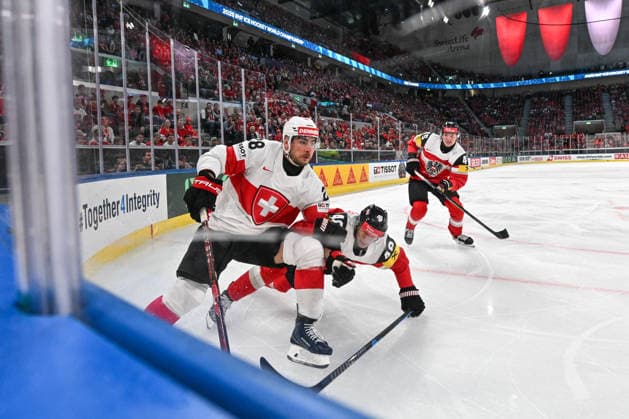 ZURICH, SWITZERLAND - MAY 20: Timo Meier of Switzerland and Lucas Thaler of Austria battle along the boards during the 2026 IIHF Ice hockey, Eishockey World Championship, WM, Weltmeisterschaft Switzerland game between Austria and Switzerland at Swiss Life Arena on May 20, 2026 in Zurich, Zurich. Zurich Swiss Life Arena Zurich Switzerland Copyright: xJustPictures.ch AndreaxBrancax jp-en-EuSpIm-JP7_ANB_Aut_Swi_20052026_6435