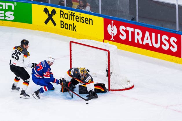ZURICH, SWITZERLAND - MAY 20: Philipp Grubauer (Germany, 30) safes the puck from Matt Coronato (United States, 27) during the Preliminary Round - Group A Match 27 between United States and Germany at the IIHF Ice hockey, Eishockey World Championship, WM, Weltmeisterschaft 2026, Swiss Life Arena on May 20, 2026 in Zurich, Switzerland. Zurich Switzerland Copyright: xTimoxSteinx
