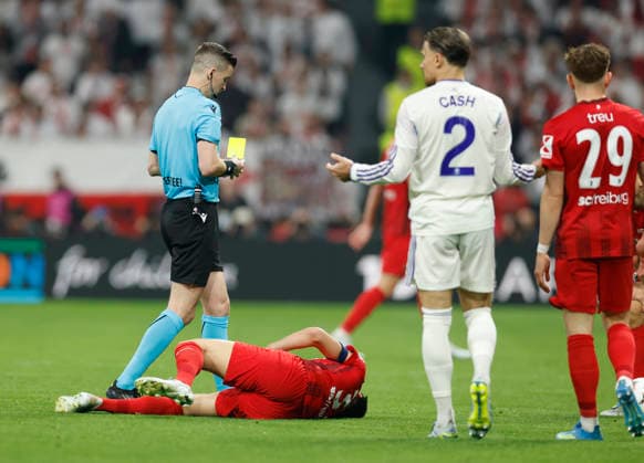 Istanbul, Turkey, 20th May 2026. Matty Cash of Aston Villa receives a yellow card for a late tackle on Vincenzo Grifo of SC Freiburg during the SC Freiburg vs Aston Villa UEFA Europa League Final match at Besiktas Park, Istanbul. Picture credit should read: Cody Froggatt Sportimage EDITORIAL USE ONLY. No use with unauthorised audio, video, data, fixture lists, club league logos or live services. Online in-match use limited to 120 images, no video emulation. No use in betting, games or single club league player publications. SPI_066_CF_Frieburg_Aston_Villa SPI-4796-0096