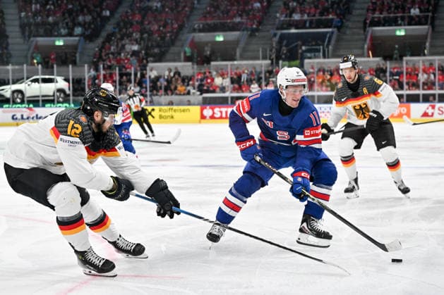 ZURICH, SWITZERLAND - MAY 20: Oliver Moore of United States R) protects the puck from Eric Mik of Germany L) during the 2026 IIHF Ice hockey, Eishockey World Championship, WM, Weltmeisterschaft Switzerland game between USA and Germany at Swiss Life Arena on May 20, 2026 in Zurich, Zurich. Zurich Swiss Life Arena Zurich Switzerland Copyright: xJustPictures.ch AndreaxBrancax jp-en-EuSpIm-JP7_ANB_USA_Ger_20052026_8425