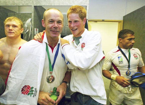RWC AUSTRALIA ENGLAND HARRY, Sydney, November 22, 2003. Britain s Prince Harry (right) celebrates in the dressing room tonight with Clive Woodward, coach of the England rugby team, after England s win in the 2003 Rugby World Cup Final match between Australia and England at Telstra Stadium. England defeated Australia 20 - 17. ( POOL SYDNEY NSW Australia  Copyright: xx 20031122000010957631-original