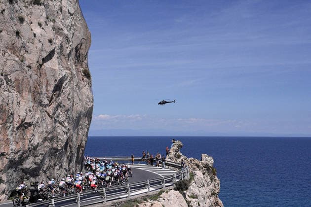 The pack rides trought Savona during Stage 12 of the Giro d™Italia, from Imperia to Novi Ligure, Italy, Thursday, May 21, 2026.  Copyright: xMarcoxAlpozzi LaPressex