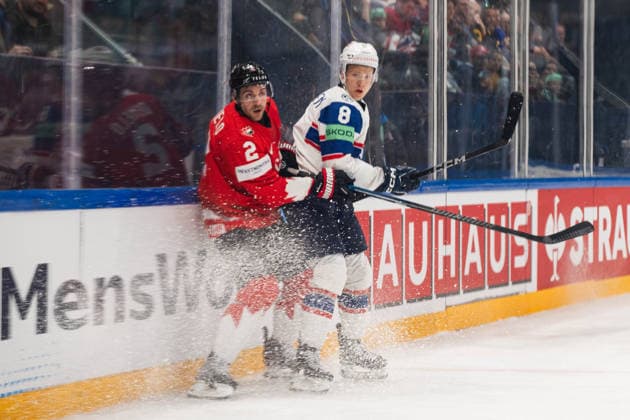 FRIBOURG, FRIBOURG - MAY 21: Dylan DeMelo of Canada battles with Mikkel Oby-Olsen of Norway during the 2026 IIHF World Championship, WM, Weltmeisterschaft Preliminary Round Group B match between Canada and Norway at BCF Arena on May 21, 2026 in Fribourg, Fribourg, Switzerland. Copyright: xLivioxBaeriswylx xSPPx Sportspressphoto_SPR151122