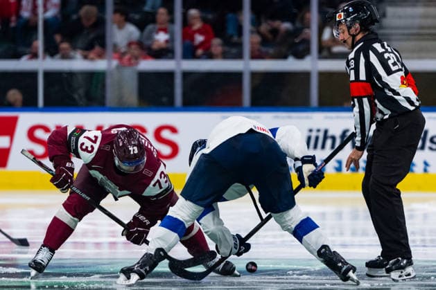 ZURICH, SWITZERLAND - MAY 21: Deniss Smirnovs (Latvia, 73) in a duel for the puck thrown by Cedric Borga (Referee) during the Preliminary Round - Group A Match 29 between Latvia and Finland at the IIHF Ice hockey, Eishockey World Championship, WM, Weltmeisterschaft 2026, Swiss Life Arena on May 21, 2026 in Zurich, Switzerland. Zurich Switzerland Copyright: xTimoxSteinx