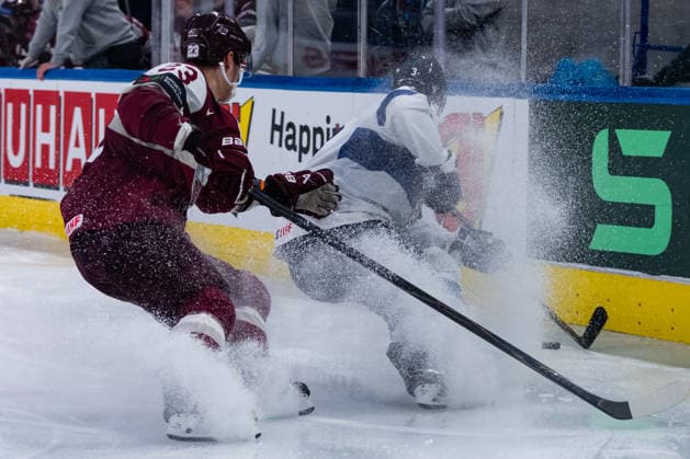 ZURICH, SWITZERLAND - MAY 21: Sandis Vilmanis (Latvia, 23) in the battle for the puck with Olli Maeaettae (Finland, 3) during the Preliminary Round - Group A Match 29 between Latvia and Finland at the IIHF Ice hockey, Eishockey World Championship, WM, Weltmeisterschaft 2026, Swiss Life Arena on May 21, 2026 in Zurich, Switzerland. Zurich Switzerland Copyright: xTimoxSteinx