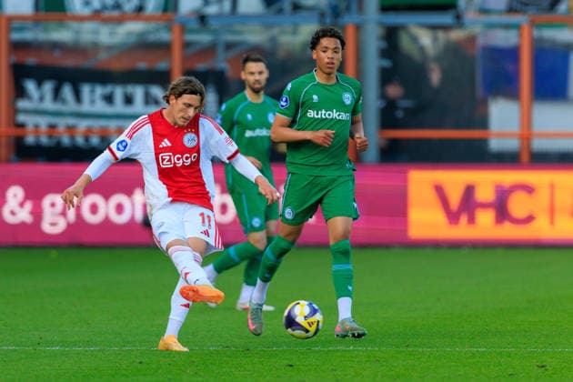2026-05-21 AFC Ajax v FC Groningen - Dutch Eredivisie Play-Offs VOLENDAM, NETHERLANDS - MAY 21: Mika Godts of Ajax, Travis Hernes of FC Groningen during the Dutch Eredivisie Play-Offs match between AFC Ajax and FC Groningen at Kras Stadion on May 21, 2026 in Volendam, Netherlands. Volendam Kras Stadion Netherlands Content not available for redistribution in The Netherlands directly or indirectly through any third parties. Copyright: xMarcelxvanxPlateringenx