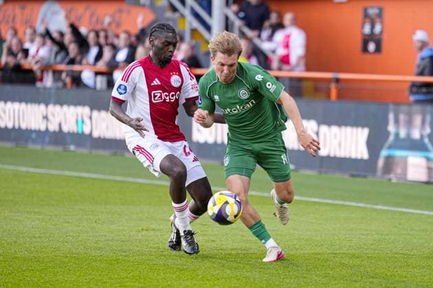 VOLENDAM , 21-05-2026 , Kras Stadium, season 2025 2026 , Play-offs for European football , Dutch Eredivisie Football . Match between Ajax and FC Groningen , picture shows Ajax player Jorthy Mokio , FC Groningen player Jorg Schreuders Ajax - Groningen (play off)  x203866795x Copyright:
