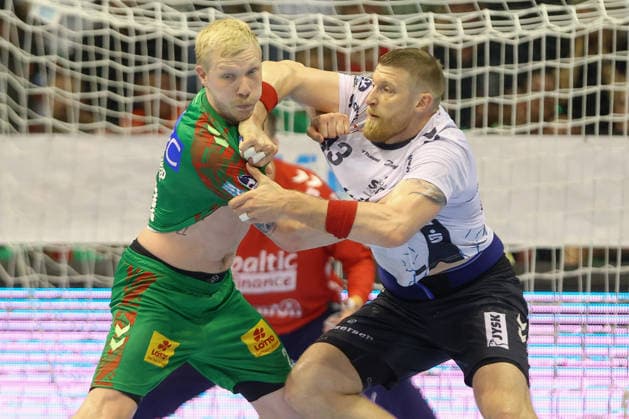 21.05.2026, xtgx, Handball, Daikin HBL, SC Magdeburg - SG Flensburg Handewitt v.l. Magnus Saugstrup (Magdeburg, 23) Blaz Blagotsinek (Flensburg, 43) Zweikampf, Duell, Kampf, tackle Magdeburg