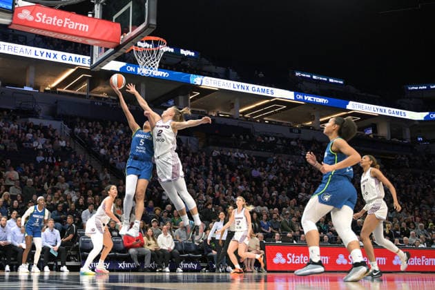 MINNEAPOLIS, MN - MAY 21: Minnesota Lynx guard Olivia Miles (5) would get the basket and the foul on this play with Toronto Tempo forward Laura Juskaite (2) during the first half of a WNBA, Basketball Damen, USA game between the Minnesota Lynx and Toronto Tempo on May 21, 2026, at Target Center in Minneapolis MN. (Photo by Nick Wosika Icon Sportswire) WNBA: MAY 21 Toronto Tempo at Minnesota Lynx EDITORIAL USE ONLY Icon2026052104