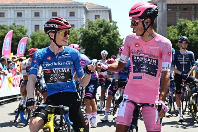May 22, 2026, Alessandria, ITALY: Portuguese rider Afonso Eulalio (R) of Bahrain Victorious, wearing the overall leader s pink jersey, and Danish rider Jonas Vingegaard Hansen of Team Visma Lease A Bike, wearing the best climber s blue jersey, pose for photographer ahead of the start of the 13th stage of the 109 Giro d Italia 2026, over 189 km from Alessandria to Verbania, Italy, 22 May 2026. ANSA LUCA ZENNARO. ITALY CYCLING GIRO D ITALIA  - ZUMAa110 20260522_zaf_a110_001 Copyright: xLucaxZennarox
