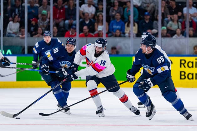 ZURICH, SWITZERLAND - MAY 22: Liam Kirk (Great Britain, 14) in the battle for the puck with Makael Seppaelae (Finaland, 55) and Vili Saarijaervi (Finland, 18) during the Preliminary Round - Group A Match 35 between Finland and Great Britain at the IIHF Ice hockey, Eishockey World Championship, WM, Weltmeisterschaft 2026, Swiss Life Arena on May 22, 2026 in Zurich, Switzerland. Zurich Switzerland Copyright: xTimoxSteinx