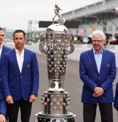 INDIANAPOLIS, IN - MAY 22: From left to right time Indy 500 winners Hello Castroneves and Rick Mears pose with the Borg Warner Trophy on the yard of bricks during Miller Lite Carb Day for the 110th Running of the Indianapolis 500 on May 22, 2026, at the Indianapolis Motor Speedway in Indianapolis, Indiana. (Photo by Brian Spurlock Icon Sportswire) AUTO: MAY 22 NTT IndyCar, Indy Car, IRL, USA Series Miller Lite Carb Day EDITORIAL USE ONLY Icon26052250064