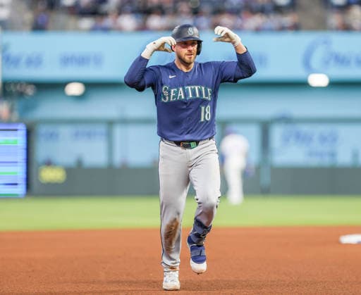 MAY 22, 2026: Seattle Mariners catcher Mitch Garver (18) celebrates at third base after hitting a home run against the Kansas City Royals at Kauffman Stadium in Kansas City, MO. CSM MLB, Baseball Herren, USA 2026: Mariners Vs Royals May 22  - ZUMAc04_ 20260522_zma_c04_079 Copyright: xRomanxPunox