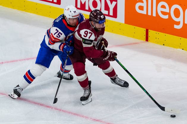 ZURICH, SWITZERLAND - MAY 23: Haralds Egle (Latvia, 97) in the battle for the puck with Connor Clifton (United States, 75) during the Preliminary Round - Group A Match 37 between Latvia and United States at the IIHF Ice hockey, Eishockey World Championship, WM, Weltmeisterschaft 2026, Swiss Life Arena on May 23, 2026 in Zurich, Switzerland. Zurich Switzerland Copyright: xTimoxSteinx