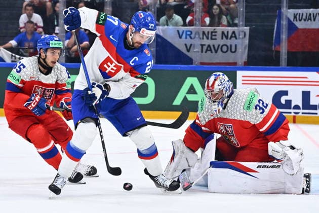 L-R Tomas Cibulka (CZE), Marek Hrivik (SVK) and goalkeeper Josef Korenar in action during the group B match of the World Ice hockey, Eishockey Championship, Slovakia - Czech Republic, Fribourg, Switzerland, on May 23, 2026. (CTKxPhoto RadekxPetrasek) CTKPhotoP2026052304947  CTKPhotoP2026052304947