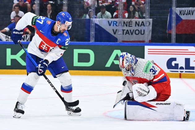 L-R Marek Hrivik (SVK) and goalkeeper Josef Korenar in action during the group B match of the World Ice hockey, Eishockey Championship, Slovakia - Czech Republic, Fribourg, Switzerland, on May 23, 2026. (CTKxPhoto RadekxPetrasek) CTKPhotoP2026052304964  CTKPhotoP2026052304964