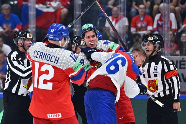 L-R Jiri Cernoch (CZE) and Jaroslav Chmelar (CZE) fighting with Martin Pospisil (SVK) during the group B match of the World Ice hockey, Eishockey Championship, Slovakia - Czech Republic, Fribourg, Switzerland, on May 23, 2026. (CTKxPhoto RadekxPetrasek) CTKPhotoP2026052305003  CTKPhotoP2026052305003