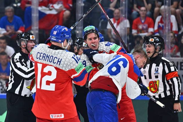 L-R Jiri Cernoch (CZE) and Jaroslav Chmelar (CZE) fighting with Martin Pospisil (SVK) during the group B match of the World Ice hockey, Eishockey Championship, Slovakia - Czech Republic, Fribourg, Switzerland, on May 23, 2026. (CTKxPhoto RadekxPetrasek) CTKPhotoP2026052305054  CTKPhotoP2026052305054