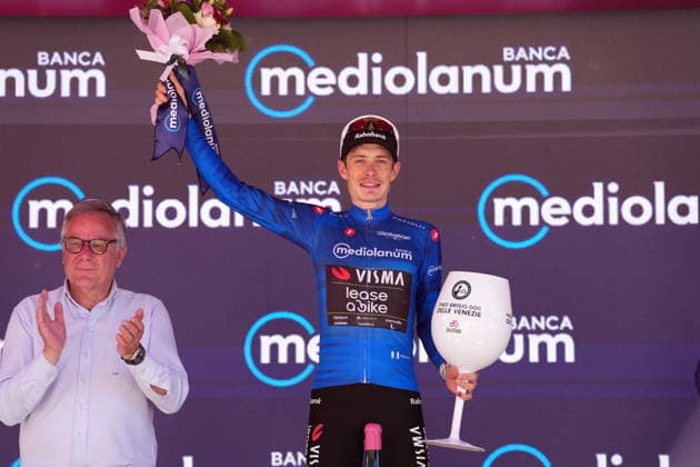 The blue jersey Jonas Vingegaard (Team Visma Lease a Bike) celebrate on the podium after the stage 14 of the Giro d™Italia, from Aosta to Pila, Italy, Saturday, May 23, 2026.  Copyright: xGianxMattiaxD™Alberto LaPressex
