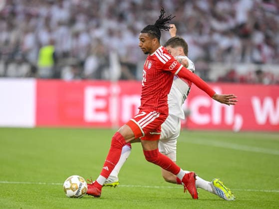 Michael Olise (FC Bayern München) und Ramon Hendriks (VfB Stuttgart) battle for the ball during the DFB Cup Final 2026 match between FC Bayern München and VfB Stuttgart at Olympiastadion on May 23, 2026 in Berlin, Germany. (Photo by Harry Langer DeFodi Images) -