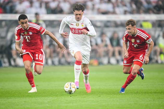 Jamal Musiala (FC Bayern München), Angelo Stiller (VfB Stuttgart) und Joshua Kimmich (FC Bayern München) battle for the ball during the DFB Cup Final 2026 match between FC Bayern München and VfB Stuttgart at Olympiastadion on May 23, 2026 in Berlin, Germany. (Photo by Harry Langer DeFodi Images) -
