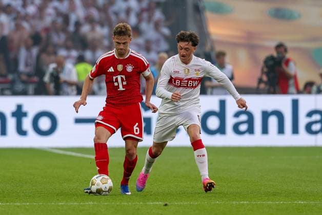 im Zweikampf, Aktion, mit Joshua Kimmich 6 (FC Bayern Muenchen), Angelo Stiller 6 (VfB Stuttgart)s, FC Bayern Muenchen vs. VfB Stuttgart, Fussball, 83. DFB-Pokalfinale, 23.05.2026 DFL DFB regulations prohibit any use of photographs as image sequences and or quasi-video Berlin Berlin Deutschland