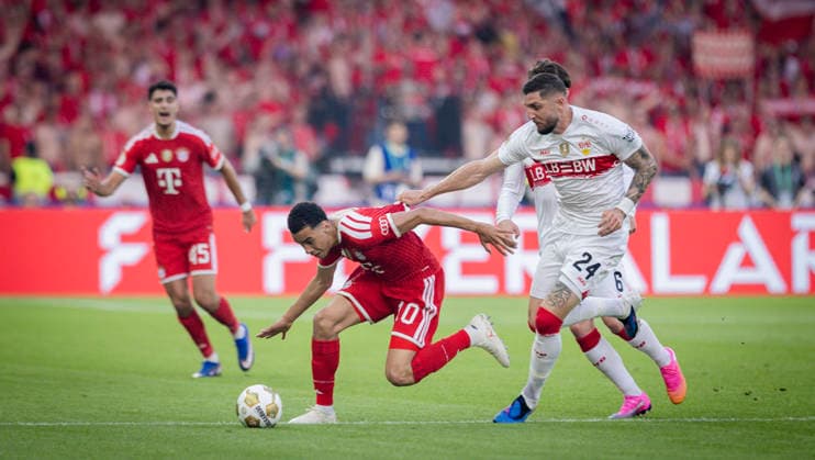 Berlin, Germany. 23rd Mai 2026. Jamal Musiala (FCB) Jeff Chabot (VfB) Bayern München - VfB Stuttgart 23.05.2026