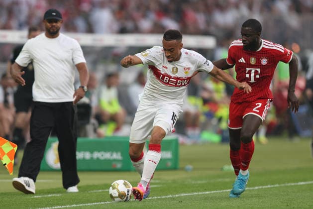 Fußball DFB-Pokal Finale FC Bayern München - VfB Stuttgart am 23.05.2026 im Olympiastadion in Berlin Jamie Leweling ( Stuttgart ), links - Dayot Upamecano ( München ), rechts DFB regulations prohibit any use of photographs as image sequences and or quasi-video.