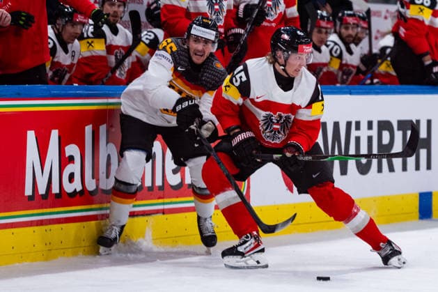ZURICH, SWITZERLAND - MAY 23: Marc Michaelis (Germany, 65) in the battle for the puck with Gregor Biber (Austria, 45) during the Preliminary Round - Group A Match 41 between Austria and Germany at the IIHF Ice hockey, Eishockey World Championship, WM, Weltmeisterschaft 2026, Swiss Life Arena on May 23, 2026 in Zurich, Switzerland. Zurich Switzerland Copyright: xTimoxSteinx