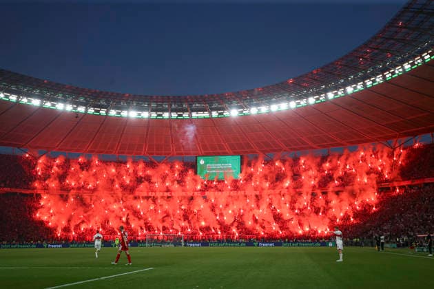 Supporters of FC Bayern München use pyrotechnics during the DFB Cup Final 2026 match between FC Bayern München and VfB Stuttgart at Olympiastadion on May 23, 2026 in Berlin, Germany. (Photo by Oliver Kaelke DeFodi Images) -