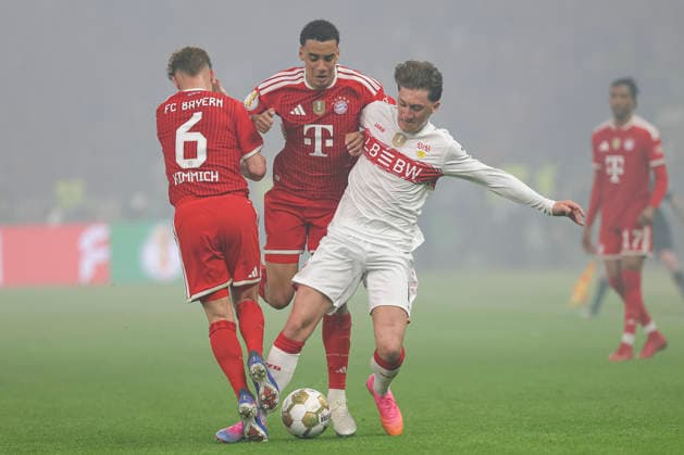 Joshua Kimmich (FC Bayern München), Jamal Musiala (FC Bayern München) und Angelo Stiller (VfB Stuttgart) battle for the ball during the DFB Cup Final 2026 match between FC Bayern München and VfB Stuttgart at Olympiastadion on May 23, 2026 in Berlin, Germany. (Photo by Oliver Kaelke DeFodi Images) -