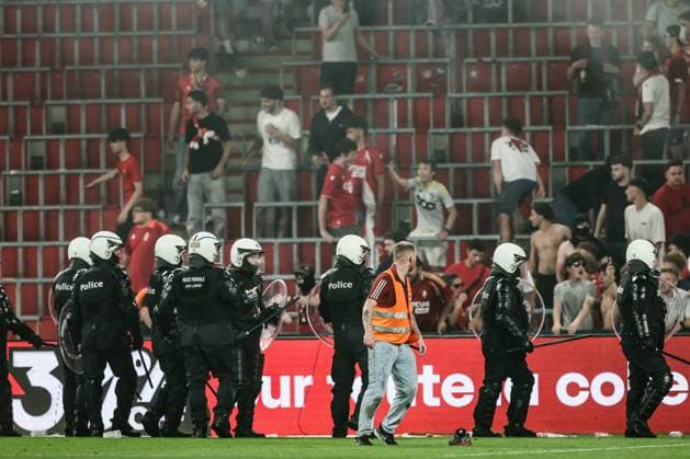 policemen on the pitch after a soccer match between Standard de Liege and Sporting Charleroi, Saturday 23 May 2026 in Liege, on the last day of the Europe Play-offs of the 2025-2026 Jupiler Pro League first division of the Belgian championship. BRUNOxFAHY  x174872945x