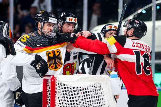 Ice hockey, Eishockey - IIHF WC 2026 ZURICH,SWITZERLAND,23.MAY.26 - ICE HOCKEY - IIHF Ice Hockey World Championship, WM, Weltmeisterschaft 2026, group stage, Austria vs Germany. Image shows Samuel Dove-McFalls (GER) and Dominic Zwerger (AUT).  GEPAxpictures xMaticxKlansek