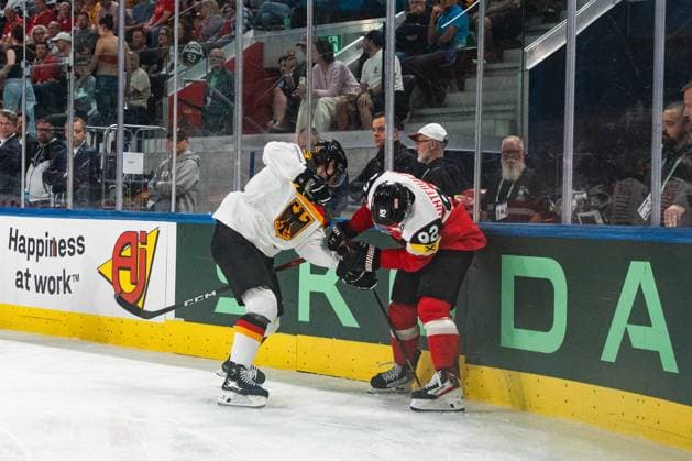 ZURICH, ZURICH - MAY 23: Lukas Reichel of Germany battles with Clemens Unterweger of Austria during the 2026 IIHF World Championship, WM, Weltmeisterschaft match between Austria and Germany at Swiss Life Arena on May 23, 2026 in Zurich, Zurich, Switzerland.  Copyright: xLivioxBaeriswylx xSPPx Sportspressphoto_153012