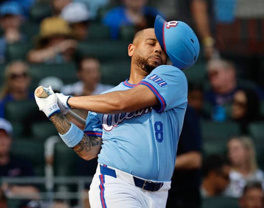 Designated hitter Domenic Smith 8 of the Atlanta Braves swings and misses in the fifth inning during the game against the Washington Nationals at Truist Park on Saturday, May 23, 2026 in Atlanta, Georgia.  ATL20260523116 MikexZarrilli