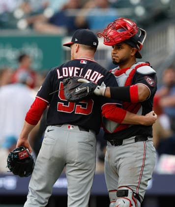 Pitcher Richard Lovelady 55 and catcher Keibert Ruiz 20 of the Washington Nationals shake hands after the last out of the game against the Atlanta Braves at Truist Park on Saturday, May 23, 2026 in Atlanta, Georgia.  ATL20260523125 MikexZarrilli