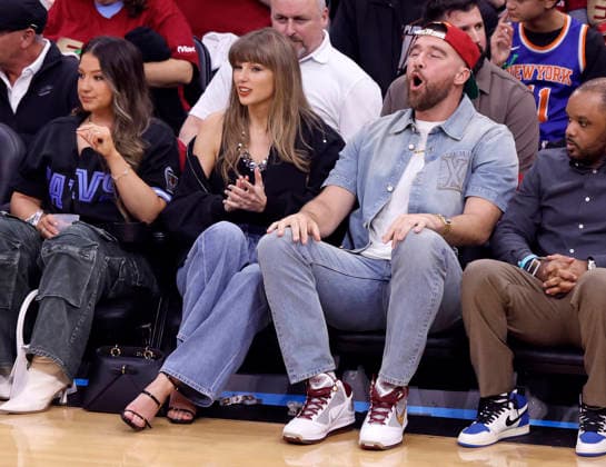 Taylor Swift and Travis Kelce cheer during the first quarter of the Cleveland Cavaliers Eastern Conference Final game against the New York Knicks in Cleveland, Ohio Saturday May 23, 2026.  CLE20260523101 AARONxJOSEFCZYK
