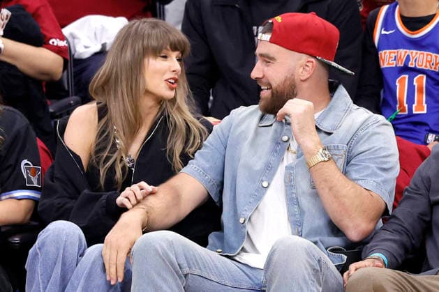 Taylor Swift and Travis Kelce talkd during the first quarter of the Cleveland Cavaliers Eastern Conference Final game against the New York Knicks in Cleveland, Ohio Saturday May 23, 2026.  CLE20260523105 AARONxJOSEFCZYK