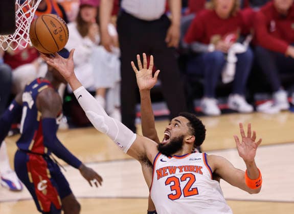 New York Knicks Karl-Anthony Towns (32) lays the ball in against the Cleveland Cavaliers during the second quarter of their Eastern Conference Final game in Cleveland, Ohio Saturday May 23, 2026.  CLE20260523109 AARONxJOSEFCZYK